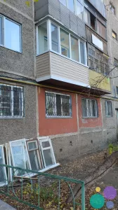 Обшивка сайдингом балкона